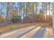 Large backyard with patio and wooded backdrop at 3110 Haverhill Ne Cv, Conyers, GA 30012