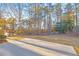 Spacious backyard with a patio and tree-lined view at 3110 Haverhill Ne Cv, Conyers, GA 30012