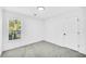 Bright bedroom with gray carpet and an exterior view at 3110 Haverhill Ne Cv, Conyers, GA 30012