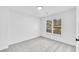 Bright bedroom with neutral walls and carpet at 3110 Haverhill Ne Cv, Conyers, GA 30012