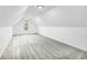 Spacious bonus room with grey carpeting and an arched window at 3110 Haverhill Ne Cv, Conyers, GA 30012