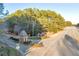 Gated community entrance with landscaping and signage at 3110 Haverhill Ne Cv, Conyers, GA 30012