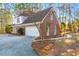 Brick home with attached garage and manicured landscaping at 3110 Haverhill Ne Cv, Conyers, GA 30012