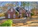 Brick house with landscaped yard and walkway at 3110 Haverhill Ne Cv, Conyers, GA 30012