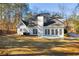 Back of house, showcasing a large backyard and patio at 3110 Haverhill Ne Cv, Conyers, GA 30012