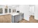 Open kitchen with gray cabinets and island at 3110 Haverhill Ne Cv, Conyers, GA 30012