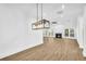 Open living room with hardwood floors and fireplace at 3110 Haverhill Ne Cv, Conyers, GA 30012