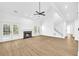 Spacious living room featuring a fireplace and hardwood floors at 3110 Haverhill Ne Cv, Conyers, GA 30012