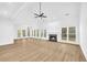 Two story living room with hardwood floors and fireplace at 3110 Haverhill Ne Cv, Conyers, GA 30012