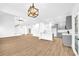 Open concept kitchen with gray cabinets and island at 3110 Haverhill Ne Cv, Conyers, GA 30012
