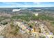 Aerial view of neighborhood with lake in the distance at 405 Ballymore Pass, Woodstock, GA 30189