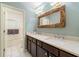 Double vanity bathroom with a large mirror and marble countertops at 405 Ballymore Pass, Woodstock, GA 30189