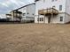Exterior view of home featuring a flat backyard, deck, and fresh grass at 5043 Baywood Ln, Woodstock, GA 30188