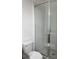 Bathroom features a tiled shower with glass doors and a white toilet at 5043 Baywood Ln, Woodstock, GA 30188