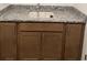 Bathroom vanity featuring a granite countertop, under-sink storage, and modern fixtures at 5043 Baywood Ln, Woodstock, GA 30188