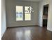 Formal dining room with hardwood floors and chandelier, view into kitchen at 5043 Baywood Ln, Woodstock, GA 30018