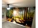 Bedroom with nature wall mural, ceiling fan, and carpet at 6636 Saint Jude Dr, Fairburn, GA 30213