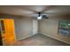 Bright bedroom with ceiling fan and carpet at 6636 Saint Jude Dr, Fairburn, GA 30213