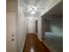 Hardwood floor entryway with an open concept view into the living room at 6636 Saint Jude Dr, Fairburn, GA 30213
