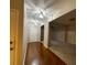 Hardwood floor entryway with an open concept view into the living room at 6636 Saint Jude Dr, Fairburn, GA 30213