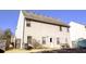 Two-story house exterior with backyard patio and fenced yard at 6636 Saint Jude Dr, Fairburn, GA 30213