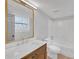 Bathroom features a new vanity, large mirror, and tub with shower at 6645 Peppermill Ln, Atlanta, GA 30349