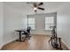 Versatile bedroom used as home office; features hardwood floors at 11253 Musette Cir, Alpharetta, GA 30009