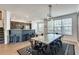 Dining area features a rustic table and modern chairs at 11253 Musette Cir, Alpharetta, GA 30009