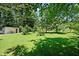 Spacious backyard with lush grass and mature trees at 1215 Brook Meadow Ct, Lawrenceville, GA 30045
