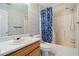 Bathroom includes a tub, shower, and wood vanity at 1215 Brook Meadow Ct, Lawrenceville, GA 30045