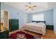 Spacious main bedroom with king-size bed and ceiling fan at 1215 Brook Meadow Ct, Lawrenceville, GA 30045