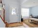 Bright entryway with hardwood floors and view into living room at 1215 Brook Meadow Ct, Lawrenceville, GA 30045