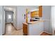 View of kitchen and adjacent hallway with tile floors at 1215 Brook Meadow Ct, Lawrenceville, GA 30045