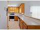 Kitchen with light wood cabinets, white countertops, and tile floors at 1215 Brook Meadow Ct, Lawrenceville, GA 30045