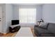 Living room with light blue walls and hardwood floors at 1215 Brook Meadow Ct, Lawrenceville, GA 30045