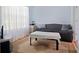 Living room with light blue walls and hardwood floors at 1215 Brook Meadow Ct, Lawrenceville, GA 30045