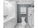 Clean bathroom featuring a vanity, toilet, glass-enclosed shower and modern fixtures at 2732 Suwanee Se Way, Marietta, GA 30067