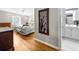Cozy bedroom featuring hardwood floors, with ensuite bathroom and lots of natural light at 2732 Suwanee Se Way, Marietta, GA 30067