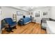 Charming Bedroom featuring a daybed, crib, and wood floors, creating a warm atmosphere at 2732 Suwanee Se Way, Marietta, GA 30067