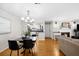 Bright dining room with hardwood floors and a view of the kitchen at 2732 Suwanee Se Way, Marietta, GA 30067