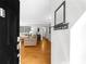Inviting entryway with wood floors, coat rack and mirror, leading to a cozy living room with a sofa at 2732 Suwanee Se Way, Marietta, GA 30067