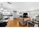 Open-concept living room and kitchen area with a fireplace, and lots of natural light at 2732 Suwanee Se Way, Marietta, GA 30067