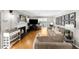 Inviting living room featuring a fireplace, hardwood floors, and comfortable seating at 2732 Suwanee Se Way, Marietta, GA 30067