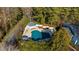 Aerial view of a community pool with a covered pool and a sun deck surrounded by lush trees at 2732 Suwanee Se Way, Marietta, GA 30067