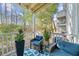 Relaxing outdoor porch area with comfortable seating and views of mature trees at 2732 Suwanee Se Way, Marietta, GA 30067