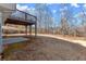 Large backyard with a deck and wooded area at 35 Matthew Ct, Covington, GA 30016