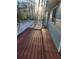 Spacious deck overlooking a wooded area, complete with a bench at 1821 N Oak Dr, Lawrenceville, GA 30044