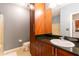Bathroom with wood cabinets, granite countertop, and a shower/tub combo at 400 17Th Nw St # 2118, Atlanta, GA 30363