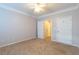 Spacious carpeted bedroom with double doors leading to closets at 400 17Th Nw St # 2118, Atlanta, GA 30363