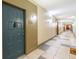 Building hallway with dark teal apartment doors and tile flooring at 400 17Th Nw St # 2118, Atlanta, GA 30363